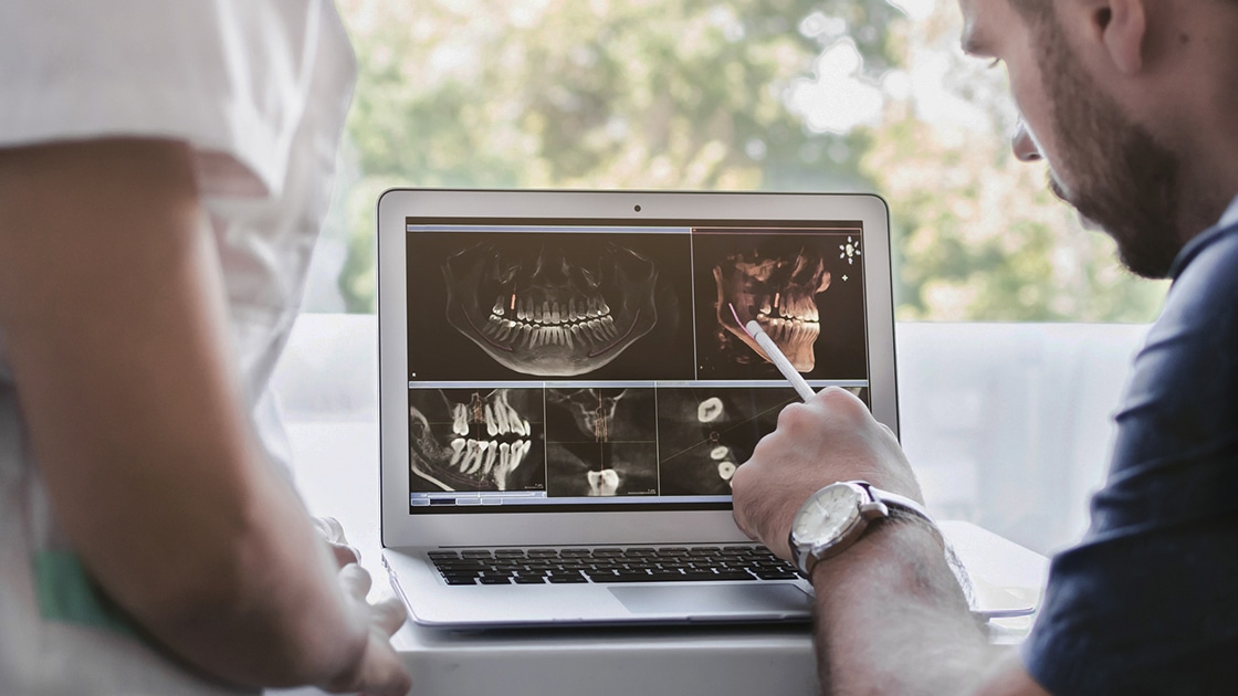 Doctor Examining X-ray Image