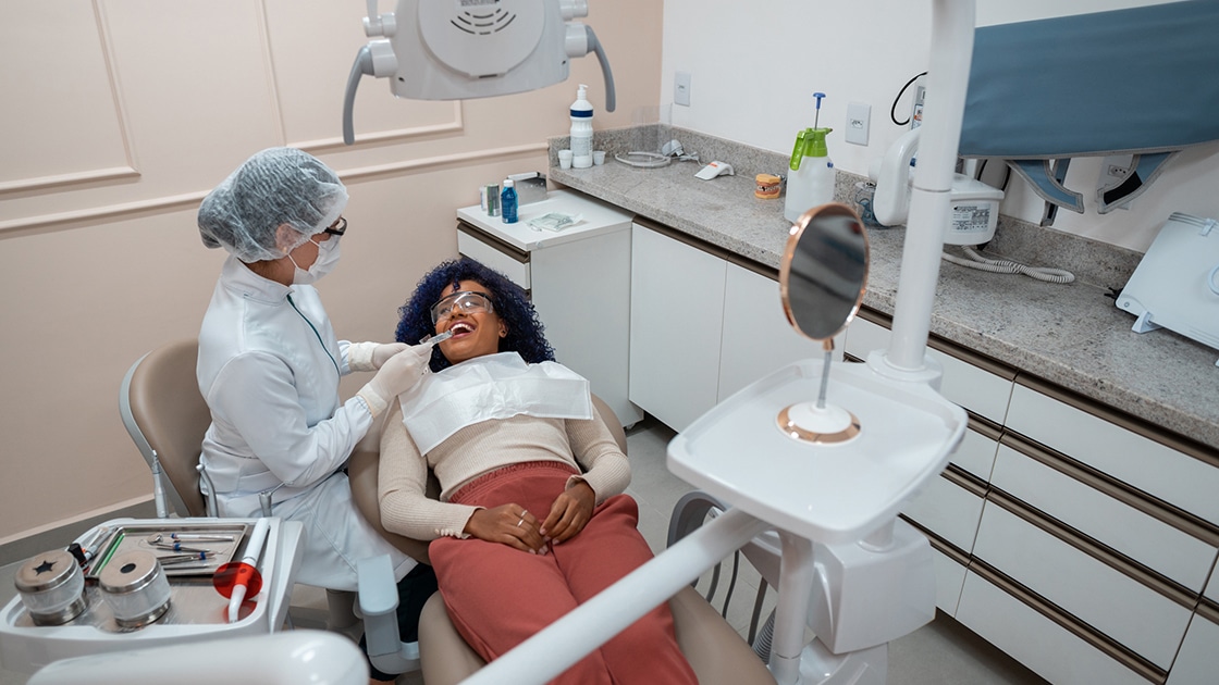 Patient gettting dental cleaning photo