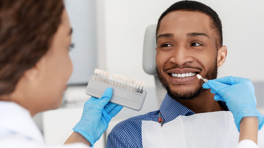 Assistant Shade matching teeth photo