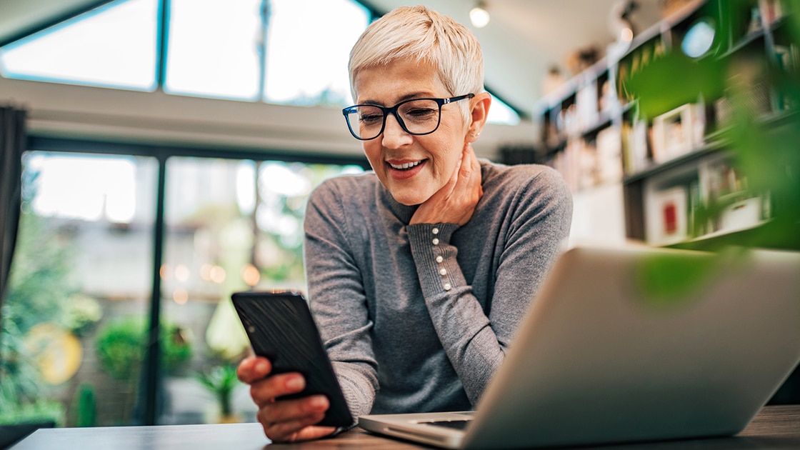 Smiling Woman at Computer Image